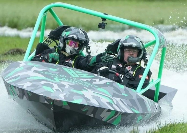 #36 carving a turn, green roll cage